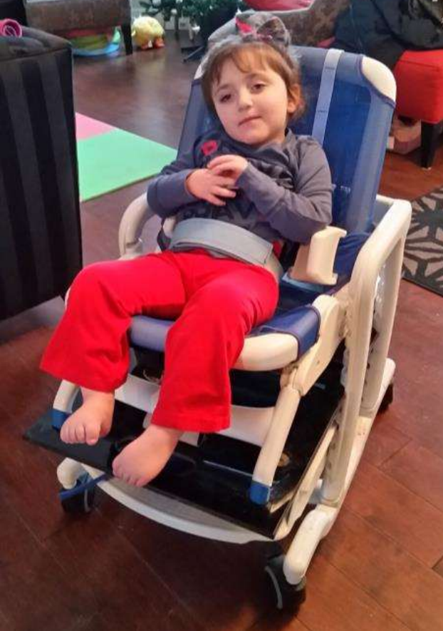 Young girl lounging in a chair